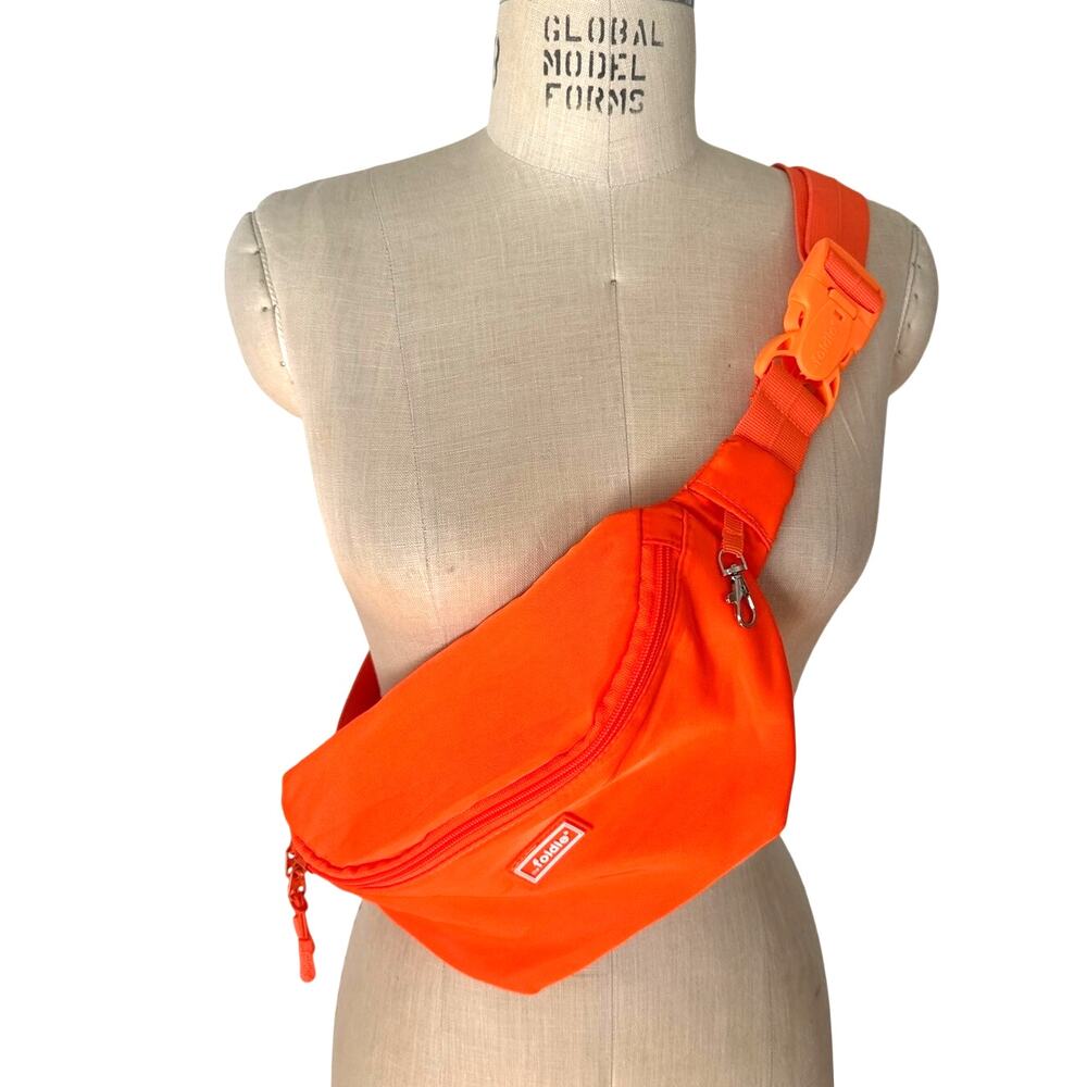 The Foldie Travel Crossbody Waist Pack Bag with Secure Buckle in Neon Orange